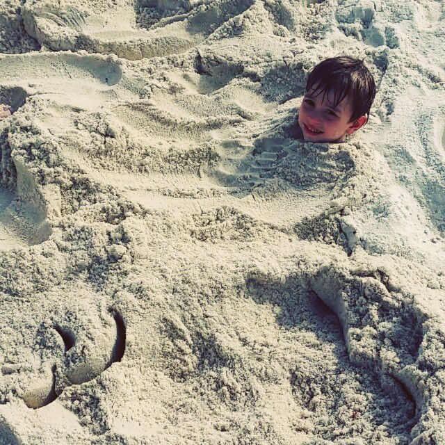 Ethan attempts a break out after being buried in the sand. #sand #beach  #BuriedAlive #OrangeBeachCondo #OrangeBeach #RegencyIsle